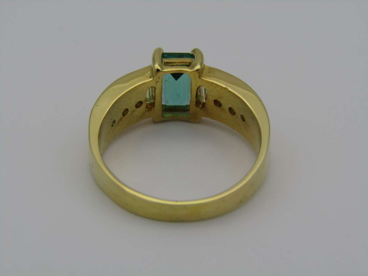 14kt gold emerald and diamond ring.
