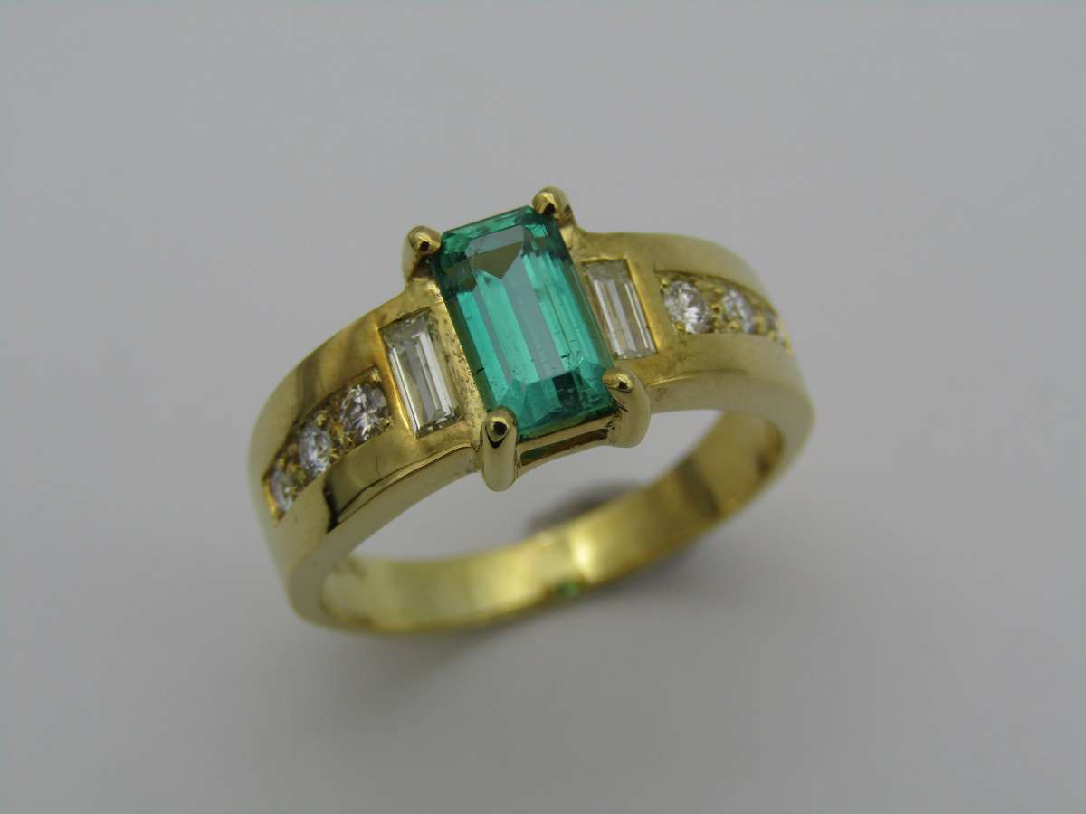 14kt gold emerald and diamond ring.