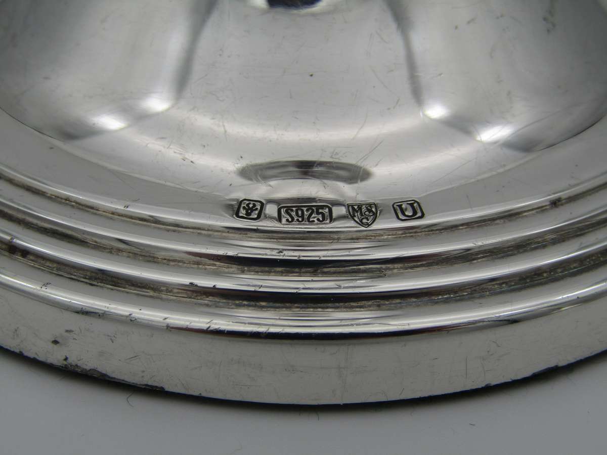 Pair of South African sterling silver candlesticks, made in 1994.