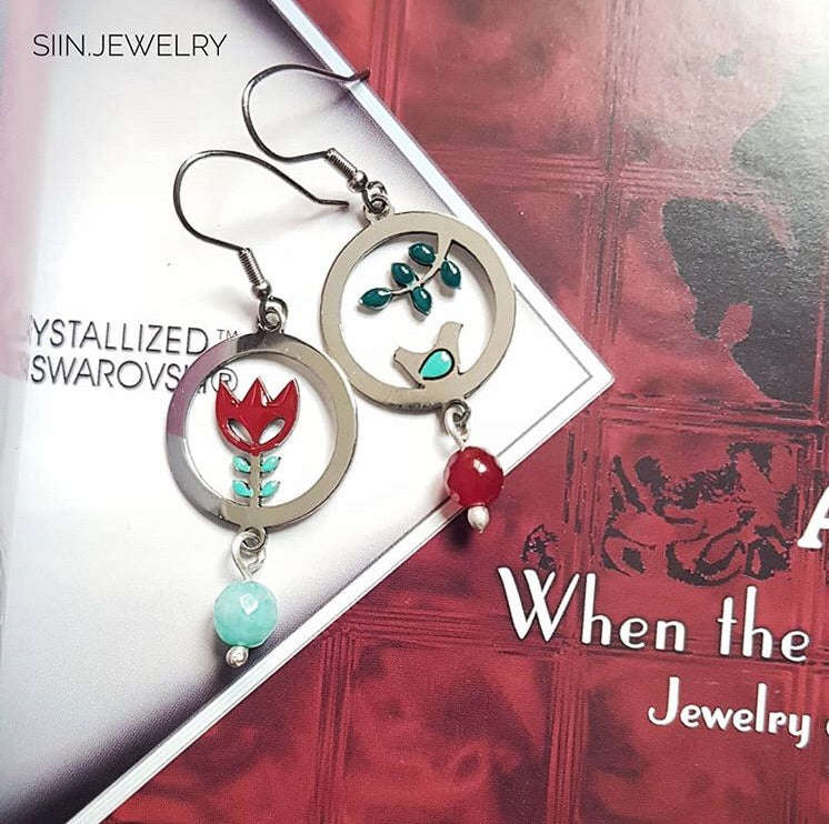 Bird and protea mismatched earrings