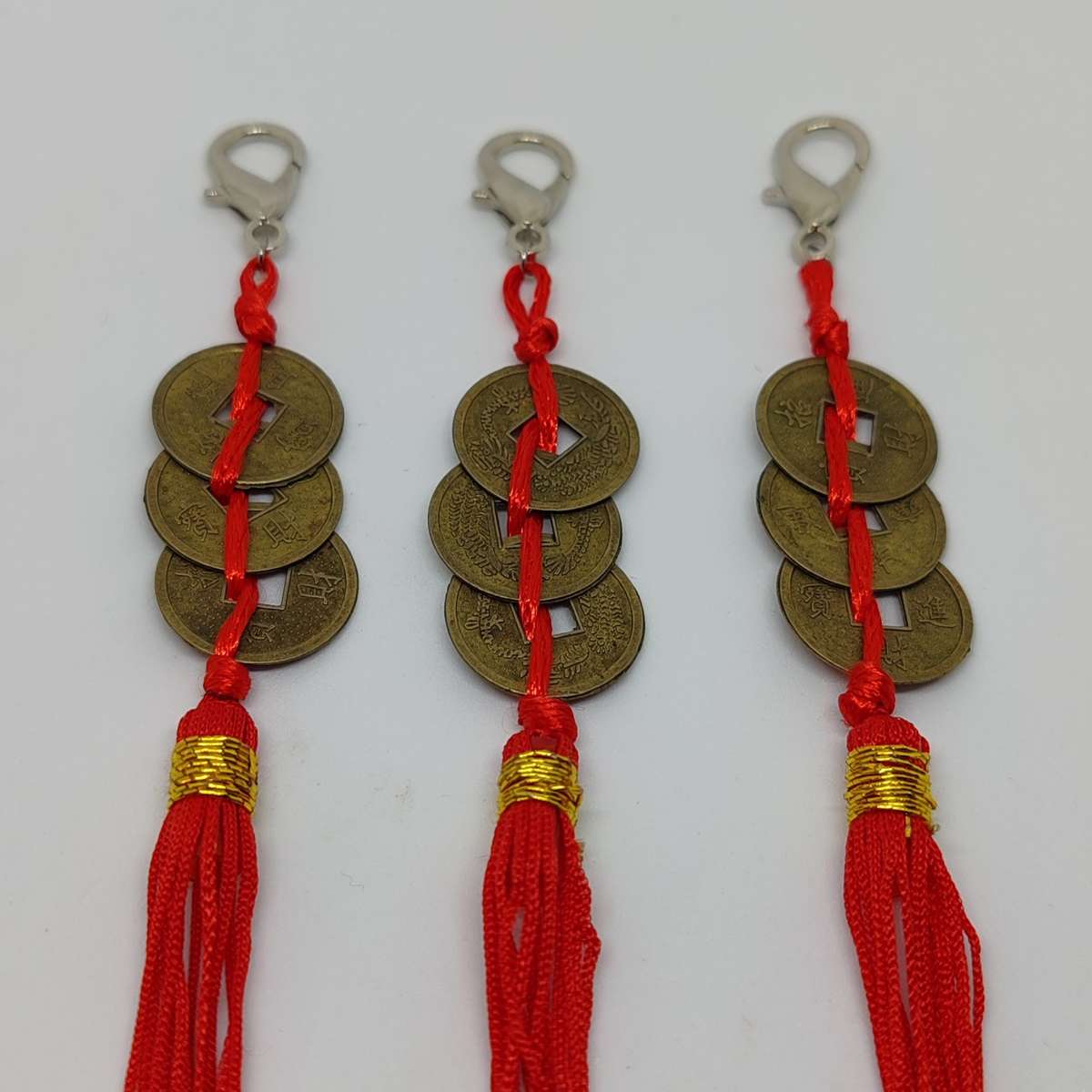 Three Chinese Coins with Red Chord