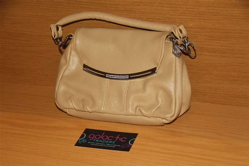 Beige faux leather mini handbag with a top handle and a detachable strap