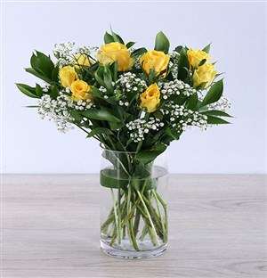 Yellow rose arrangement in a vase
