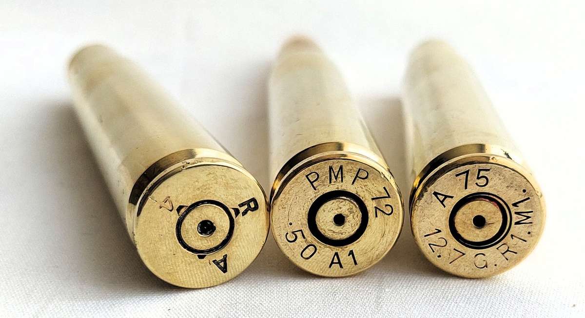 1 Set of 3 - Off Brass Shells - Caliber (12,7 mm) / .50 Browning - 2 off empty cartridges and 1 w...
