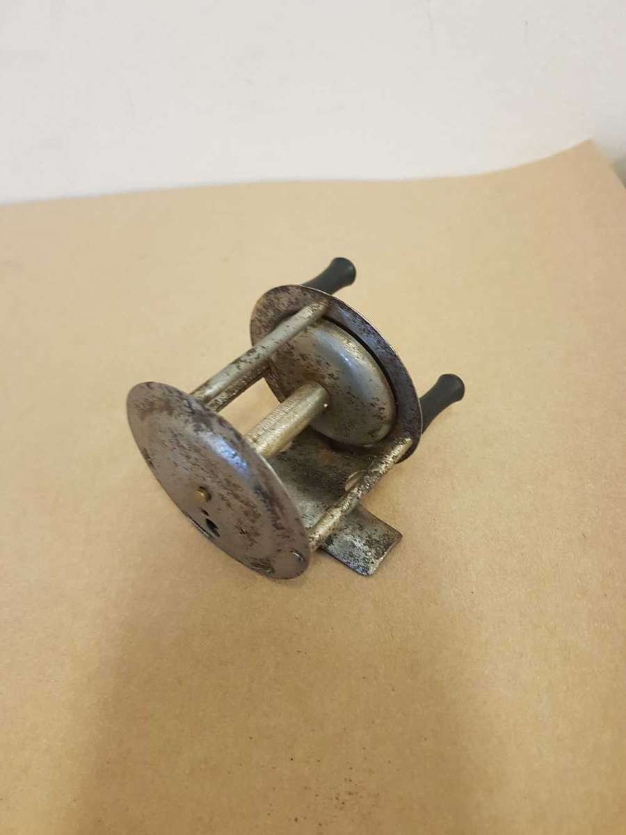 Vintage toy fishing reel.