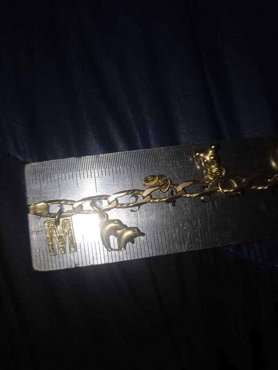 Ladies 9 carat gold charm bracelet