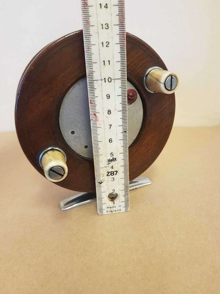 Wooden fishing reel.
