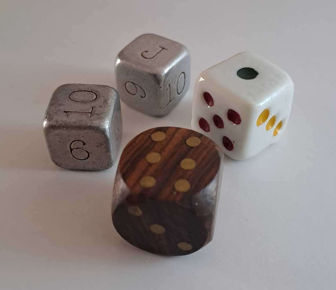 Dice collection of all colours and sizes. Some very unique pieces in wood, metal, and ceramic.