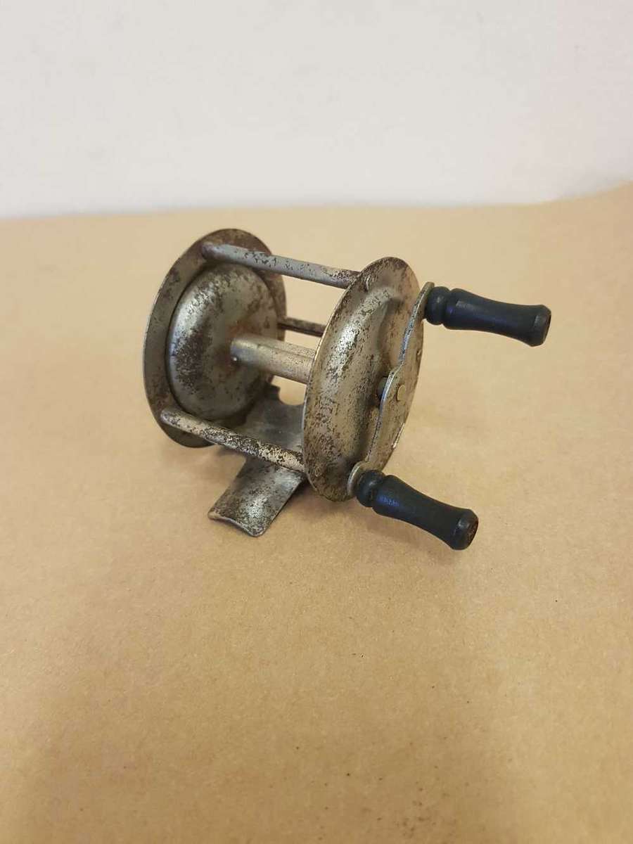 Vintage toy fishing reel.