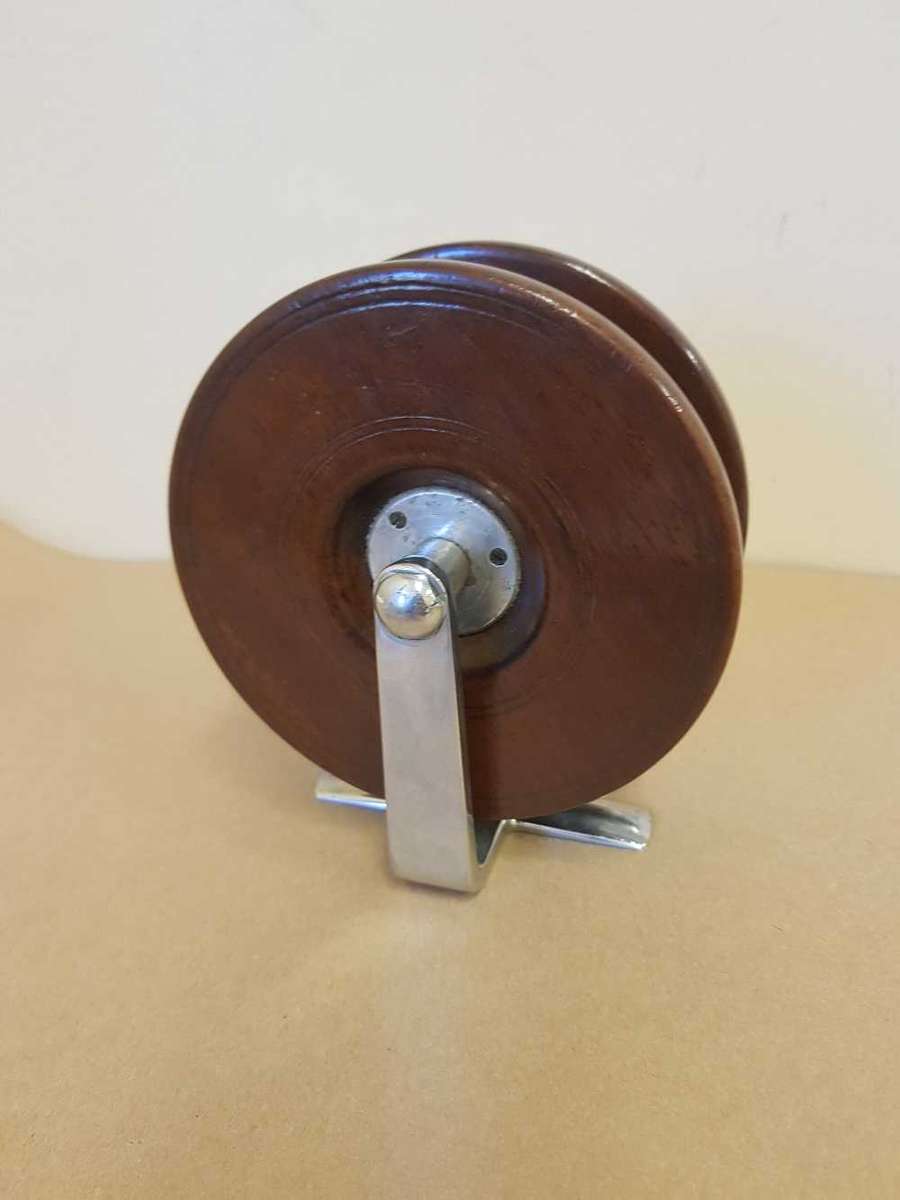 Wooden fishing reel.
