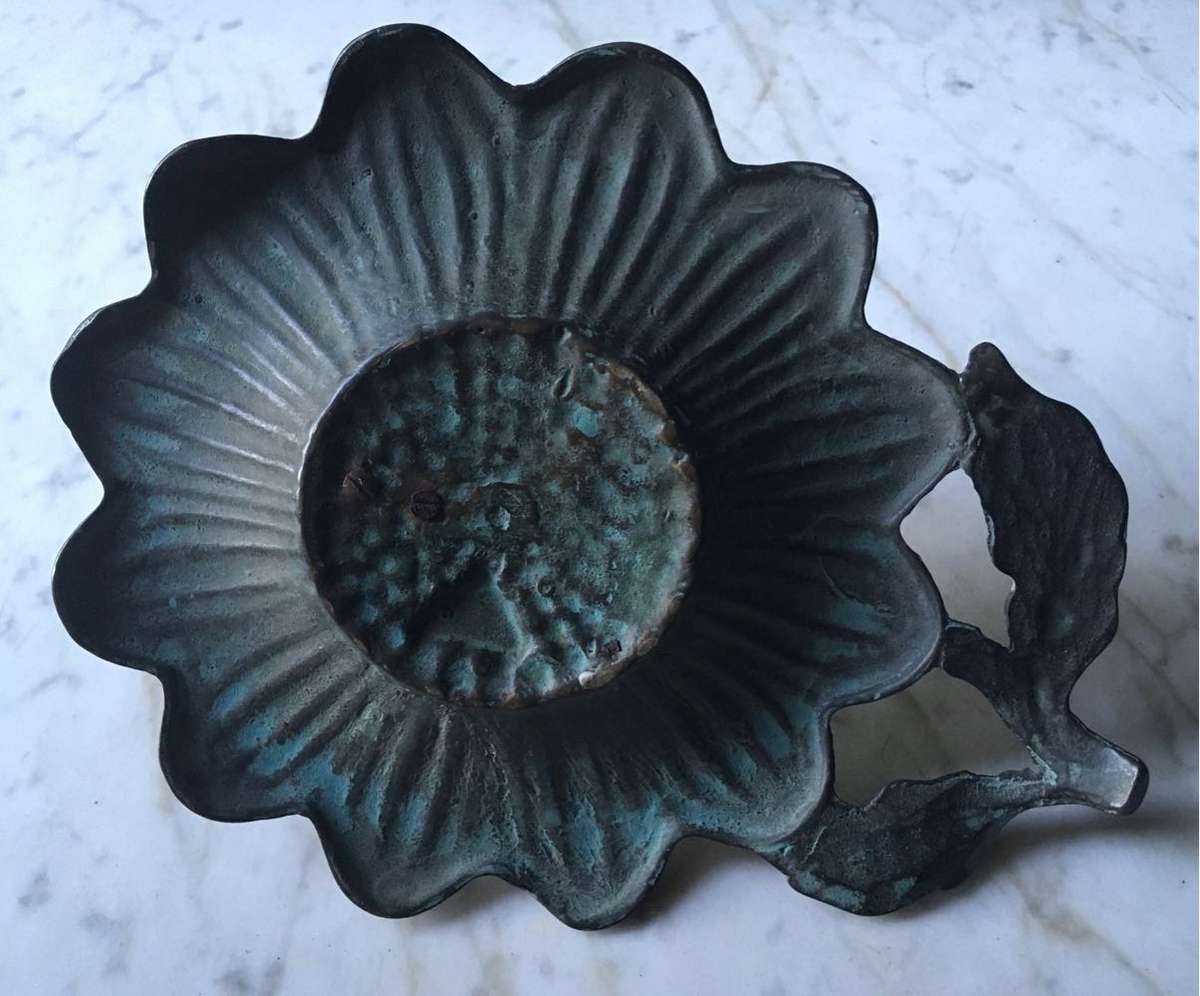 Vintage bronze sundial with dragonfly