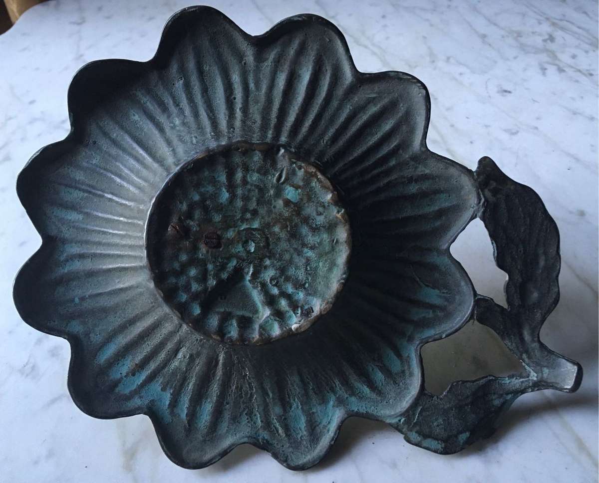 Vintage bronze sundial with dragonfly