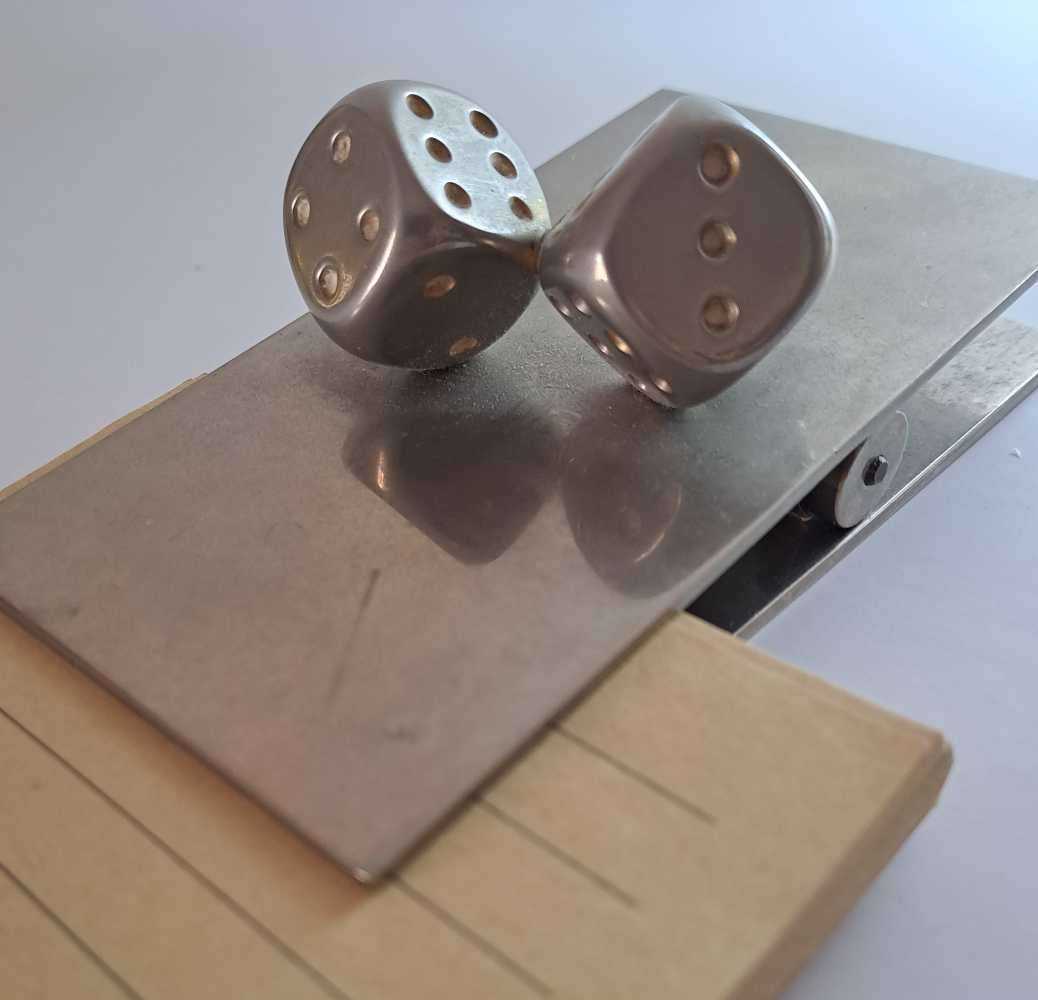 Dice collection of all colours and sizes. Some very unique pieces in wood, metal, and ceramic.