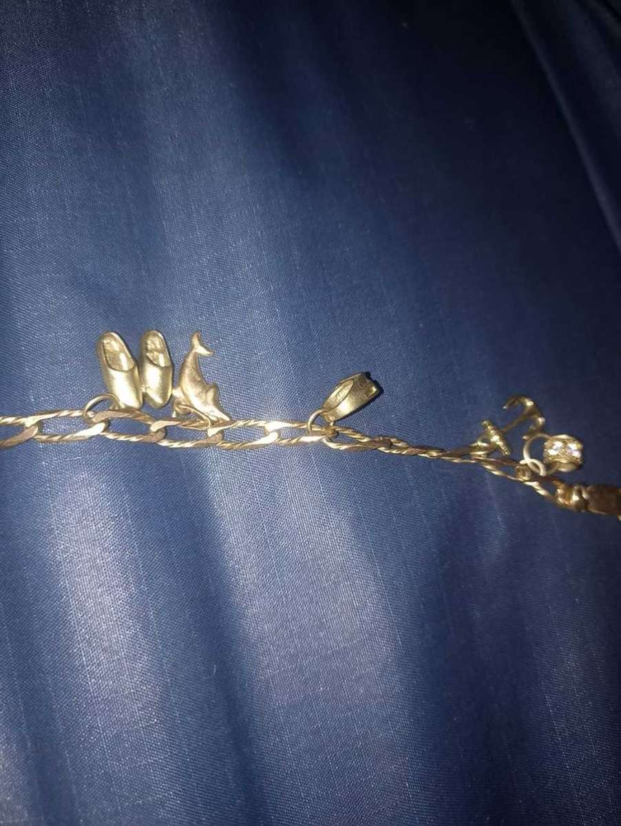 Ladies 9 carat gold charm bracelet