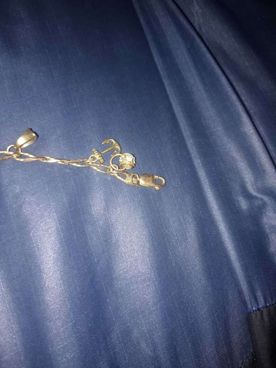 Ladies 9 carat gold charm bracelet