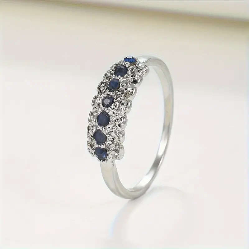 Synthetic Blue Sapphire Ring with Cubic Zirconia