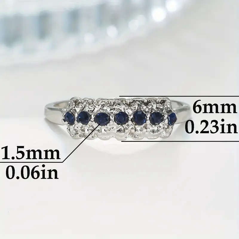 Synthetic Blue Sapphire Ring with Cubic Zirconia