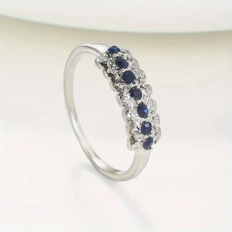 Synthetic Blue Sapphire Ring with Cubic Zirconia
