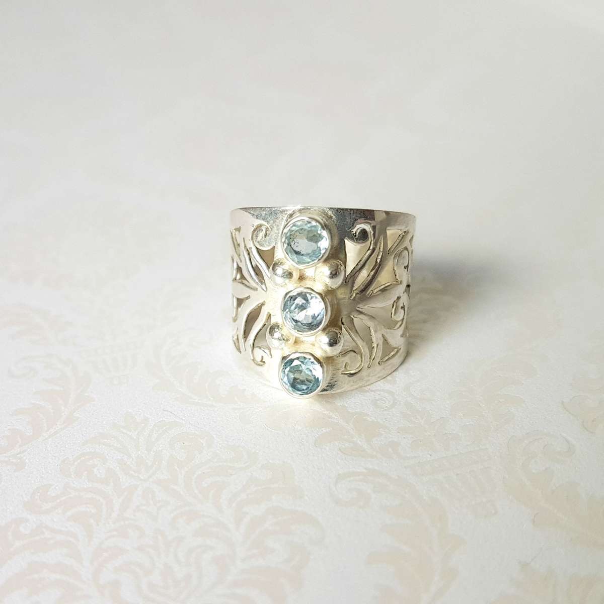 Mystical Triad Blue Topaz Sterling Silver Ring