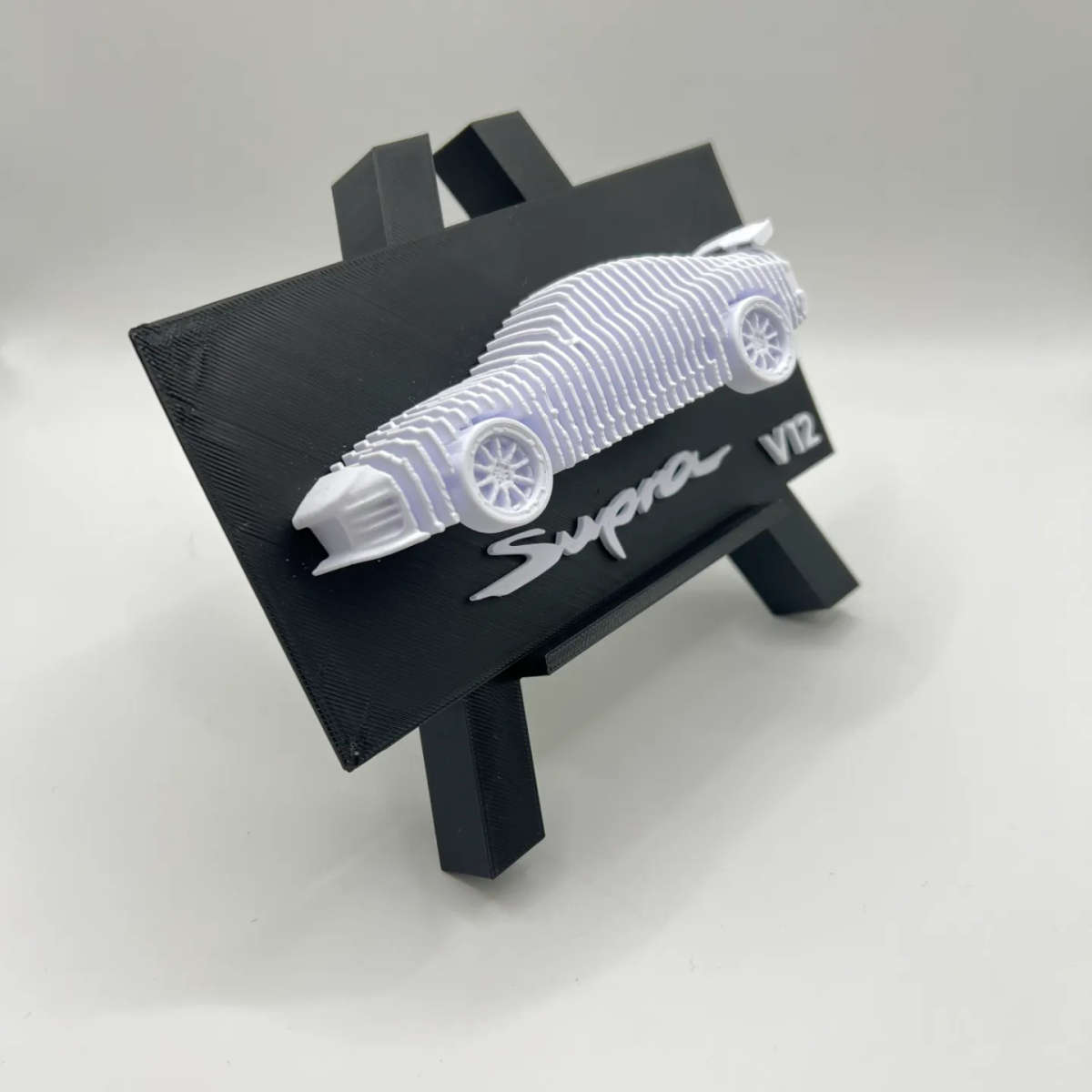 Layered Toyota Supra V12 Sculpture