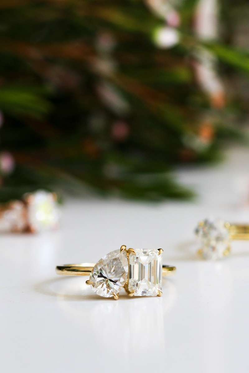 Emerald and Pear Moissanite Toi et Moi Ring