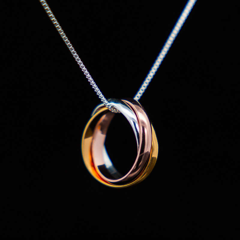 Amos - Trinity Rolling Ring Pendant