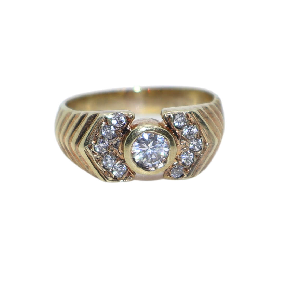 Ring - Silver Gilt.  Patterned band/ centre clear stone small clear stones on either side - ML3639
