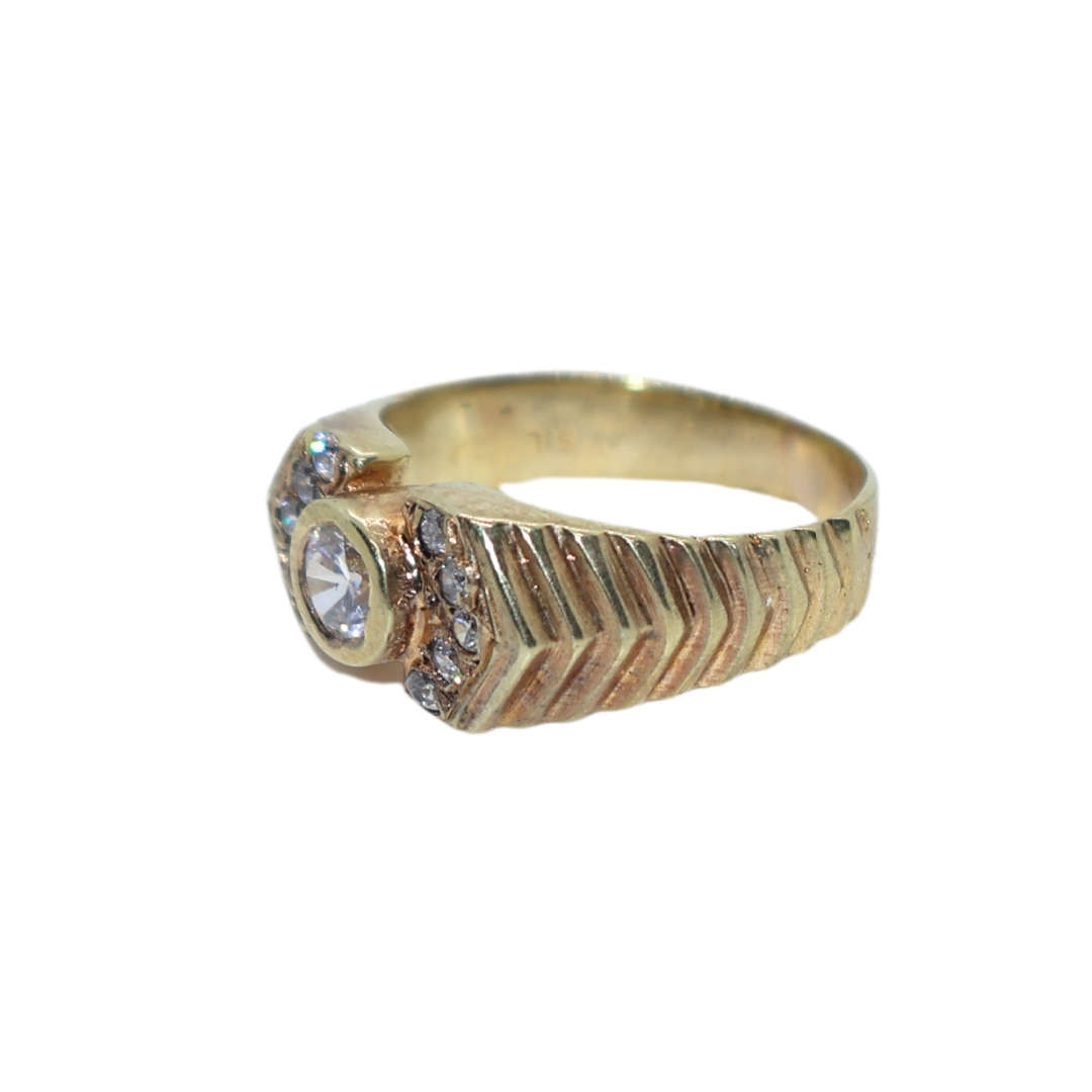 Ring - Silver Gilt.  Patterned band/ centre clear stone small clear stones on either side - ML3639