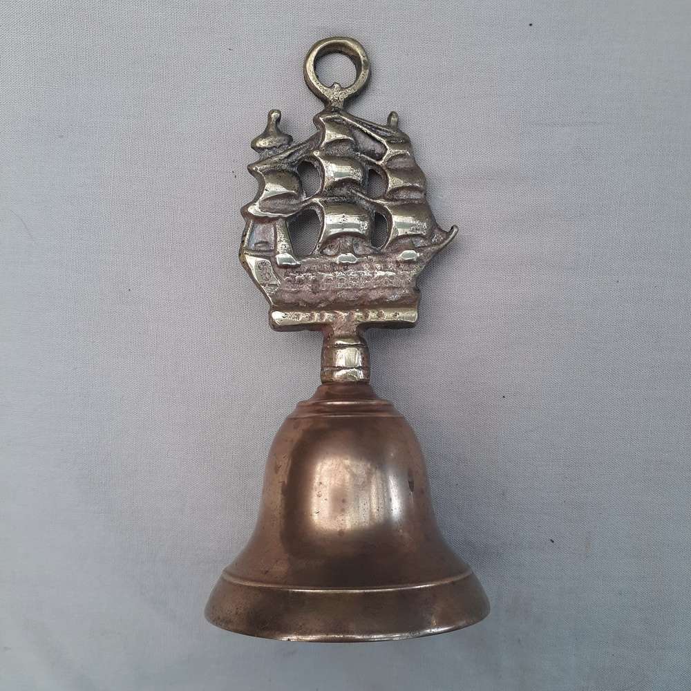 Brass bell with ship