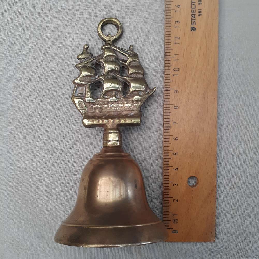Brass bell with ship