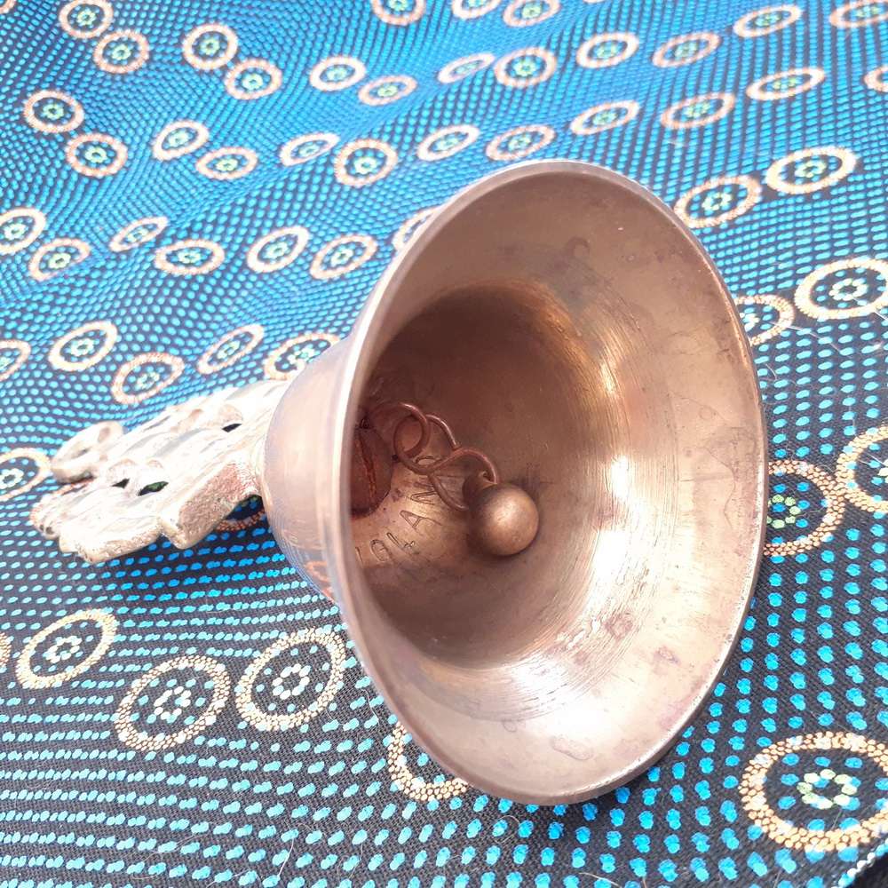 Brass bell with ship