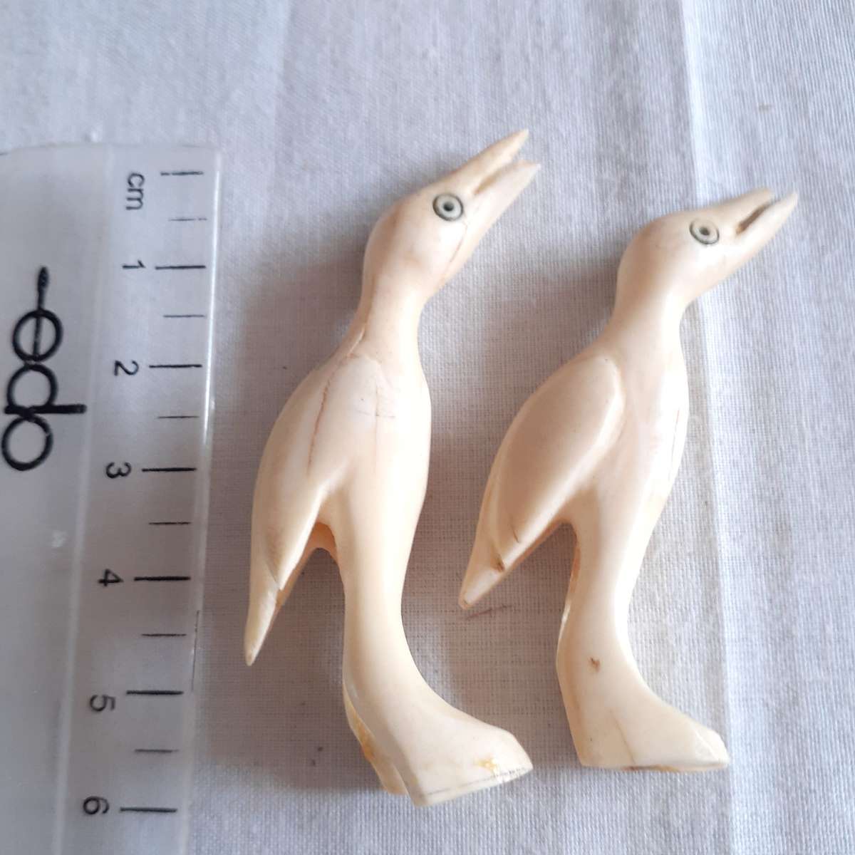 7 Little carved bone figurines birds and a crocodile