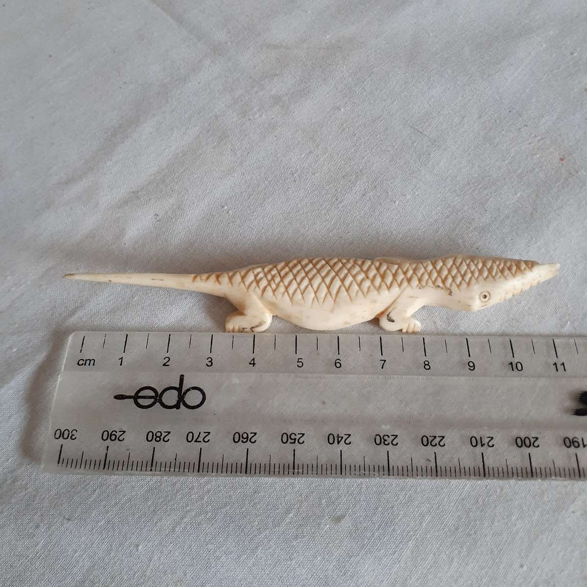 7 Little carved bone figurines birds and a crocodile