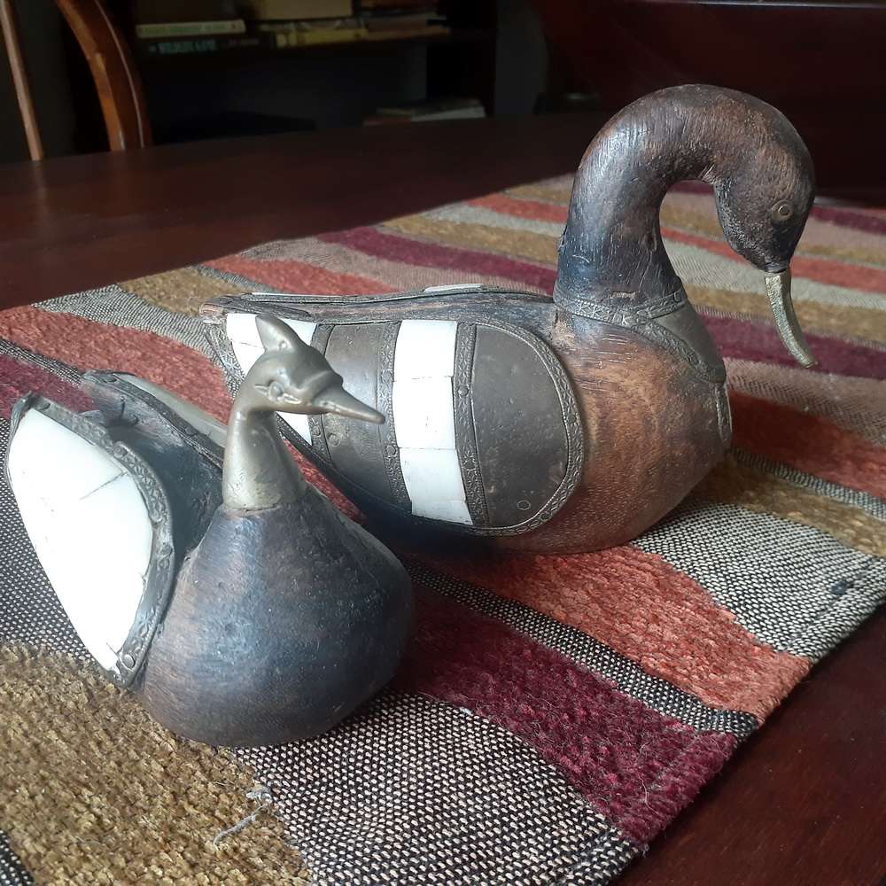 Two carved wooden ducks with bone and brass trim - vintage country decor