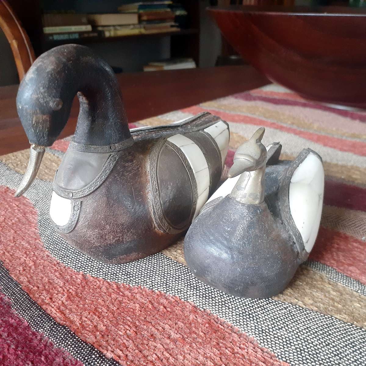 Two carved wooden ducks with bone and brass trim - vintage country decor