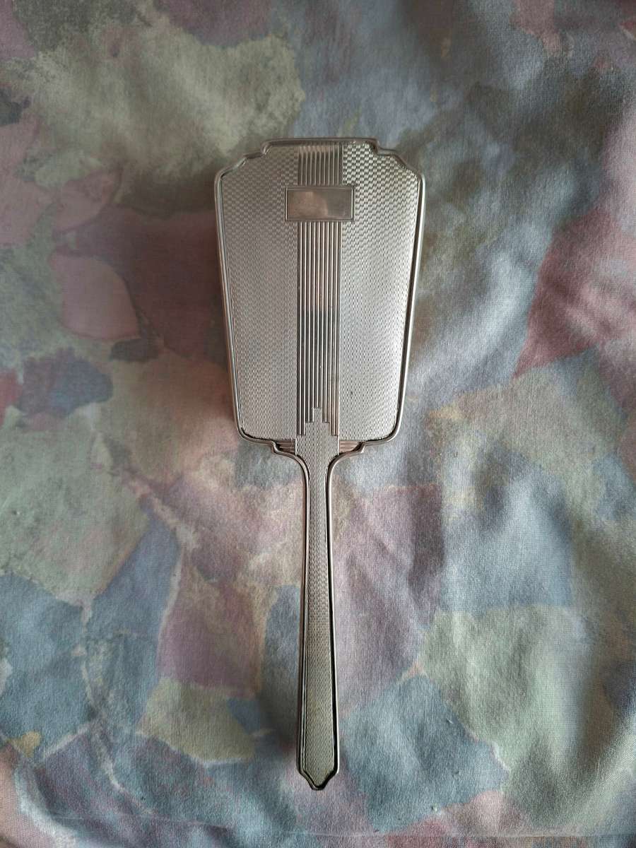 Hallmarked silver Deco hairbrush. Good condition.
