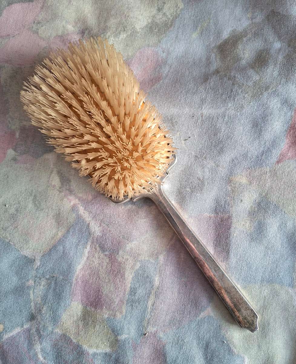 Hallmarked silver Deco hairbrush. Good condition.