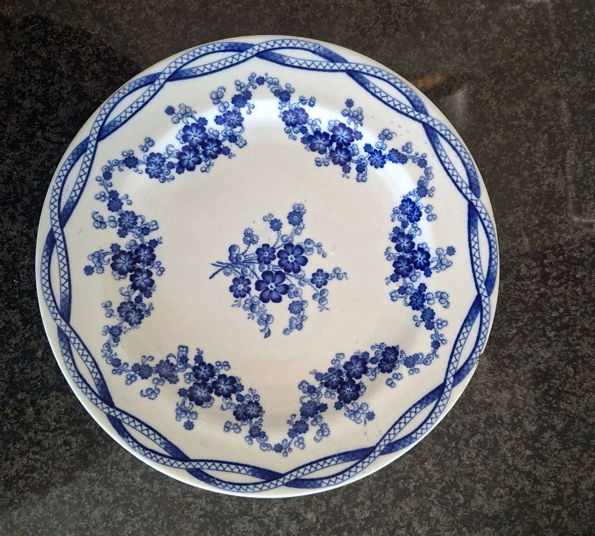 Very old blue and white plate with floral sprays