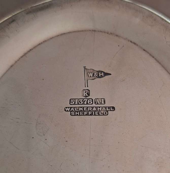 Silver plated fruit dish with two handles.   Walker and Hall.