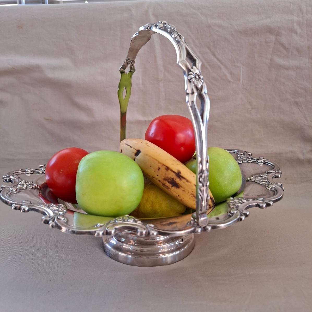 Large Silver plate fruit or wedding "basket"  Leaf and acorn scrolls around the rim.  32 cm dia