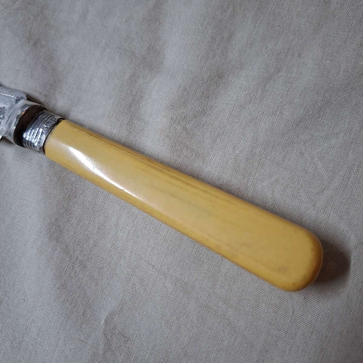 Antique Bread cake knife with silver hall marked collar - pretty etched design