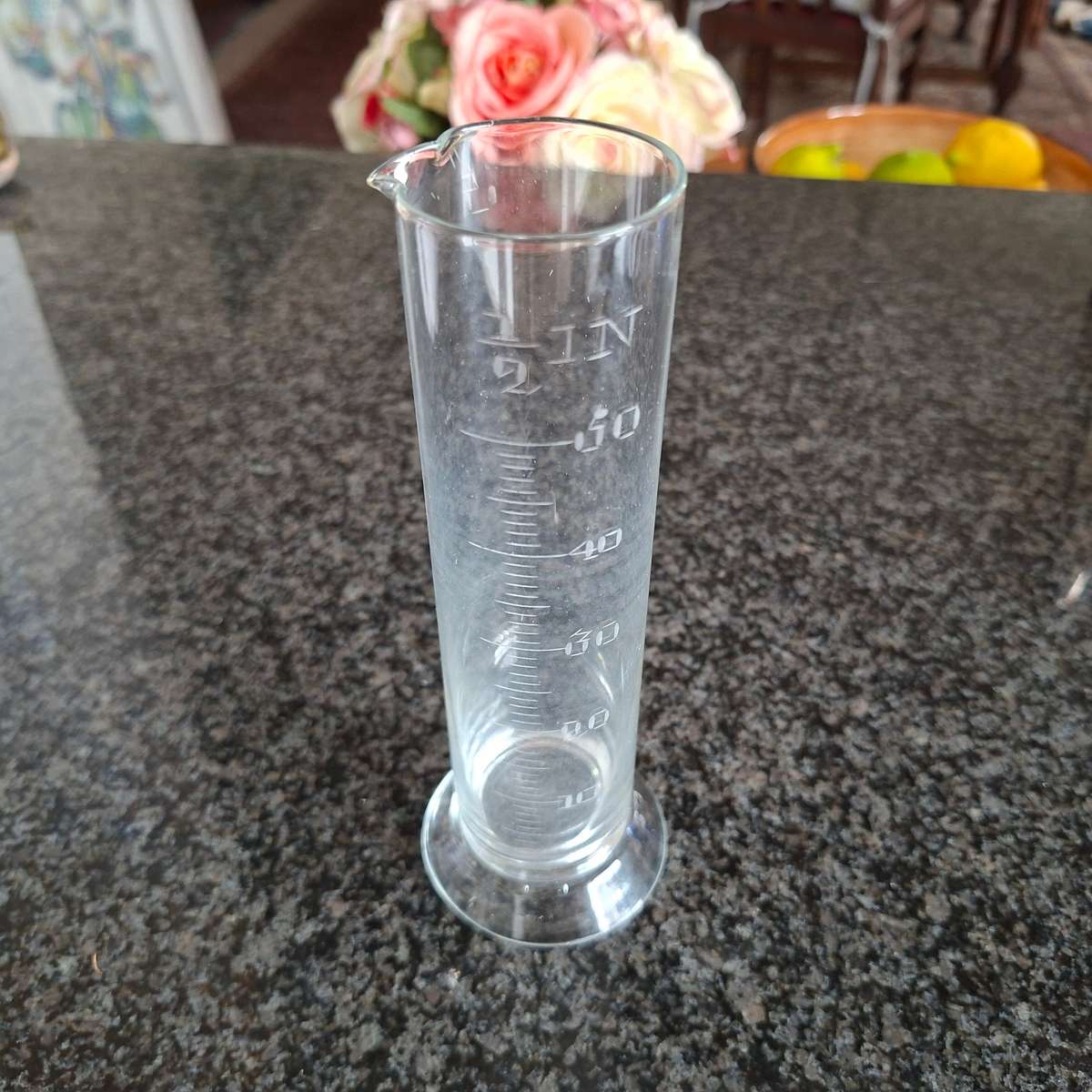 Scientific measuring glass for rain liquids.  In inches.   18 cms tall.