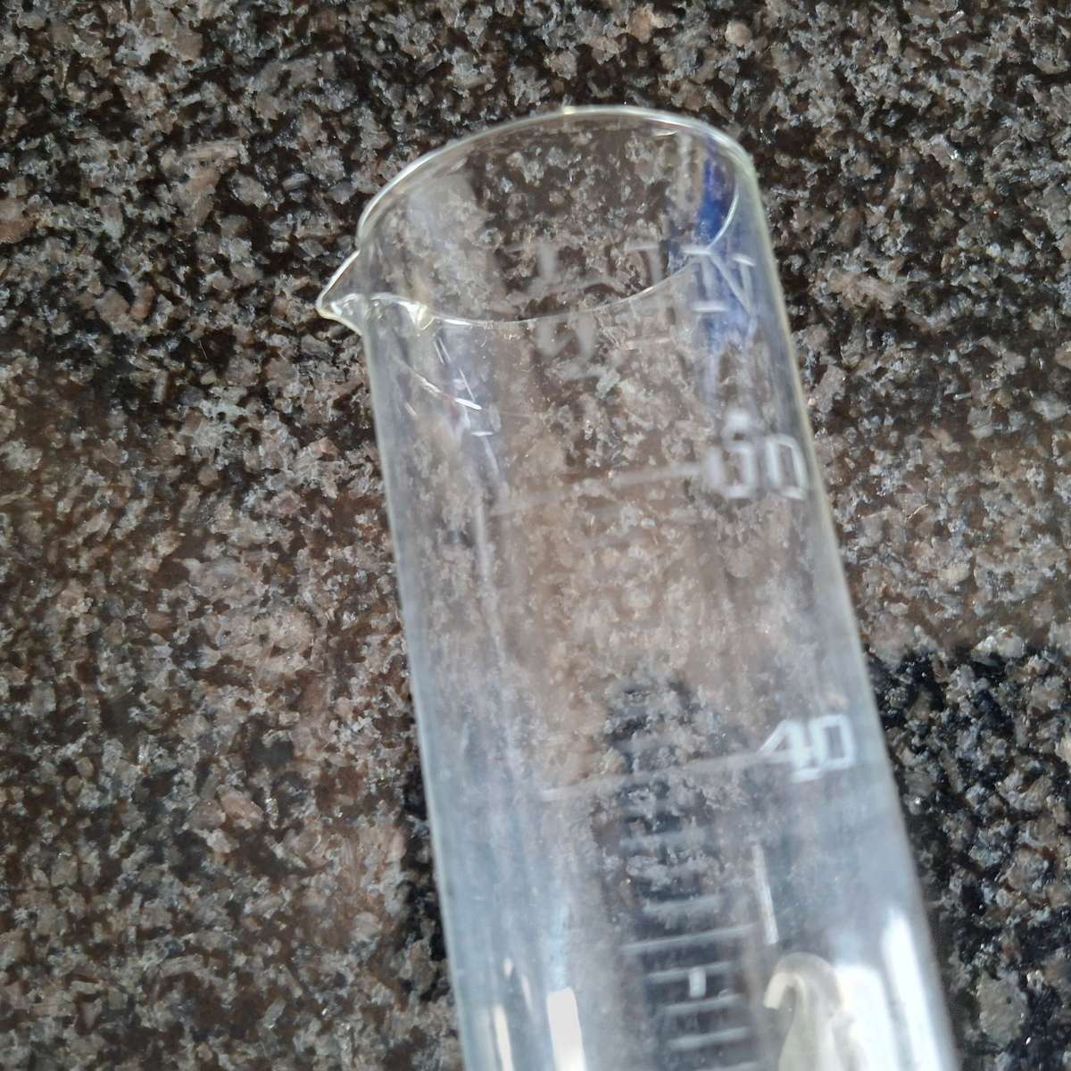 Scientific measuring glass for rain liquids.  In inches.   18 cms tall.