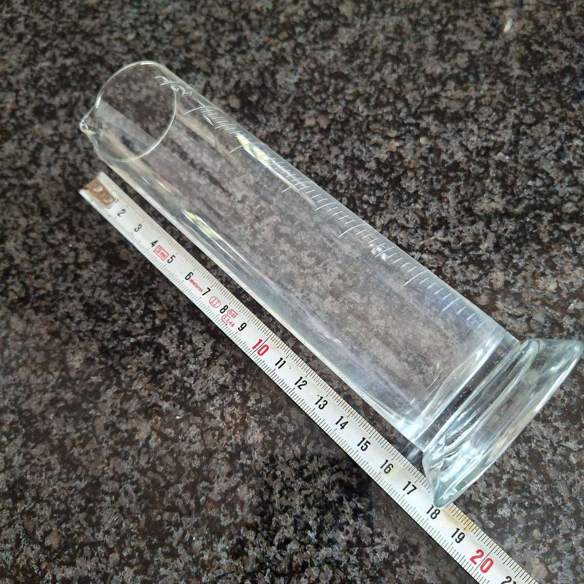 Scientific measuring glass for rain liquids.  In inches.   18 cms tall.