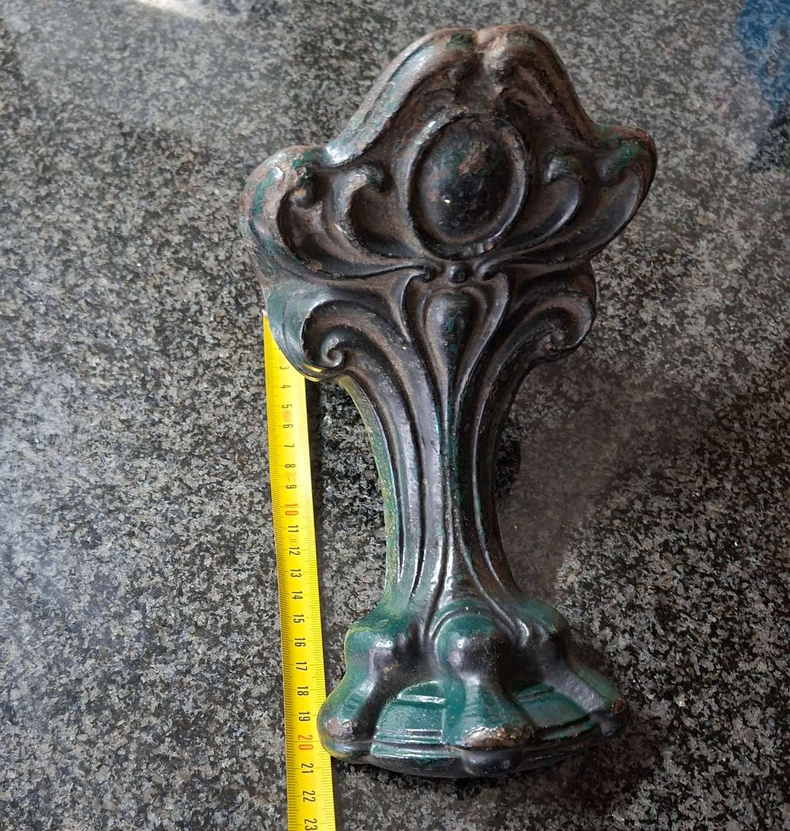 Old cast iron Door stop / leg from an antique bath.   Lions paw foot