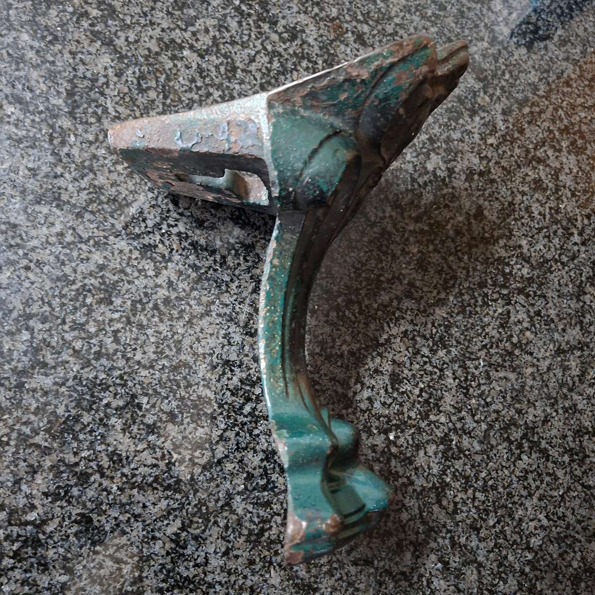 Old cast iron Door stop / leg from an antique bath.   Lions paw foot