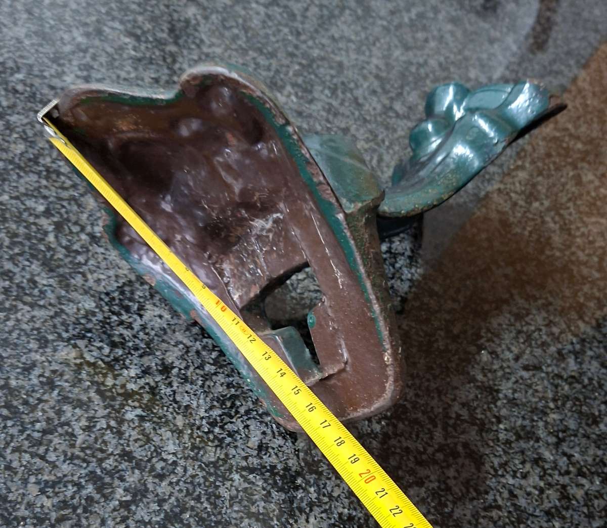 Old cast iron Door stop / leg from an antique bath.   Lions paw foot