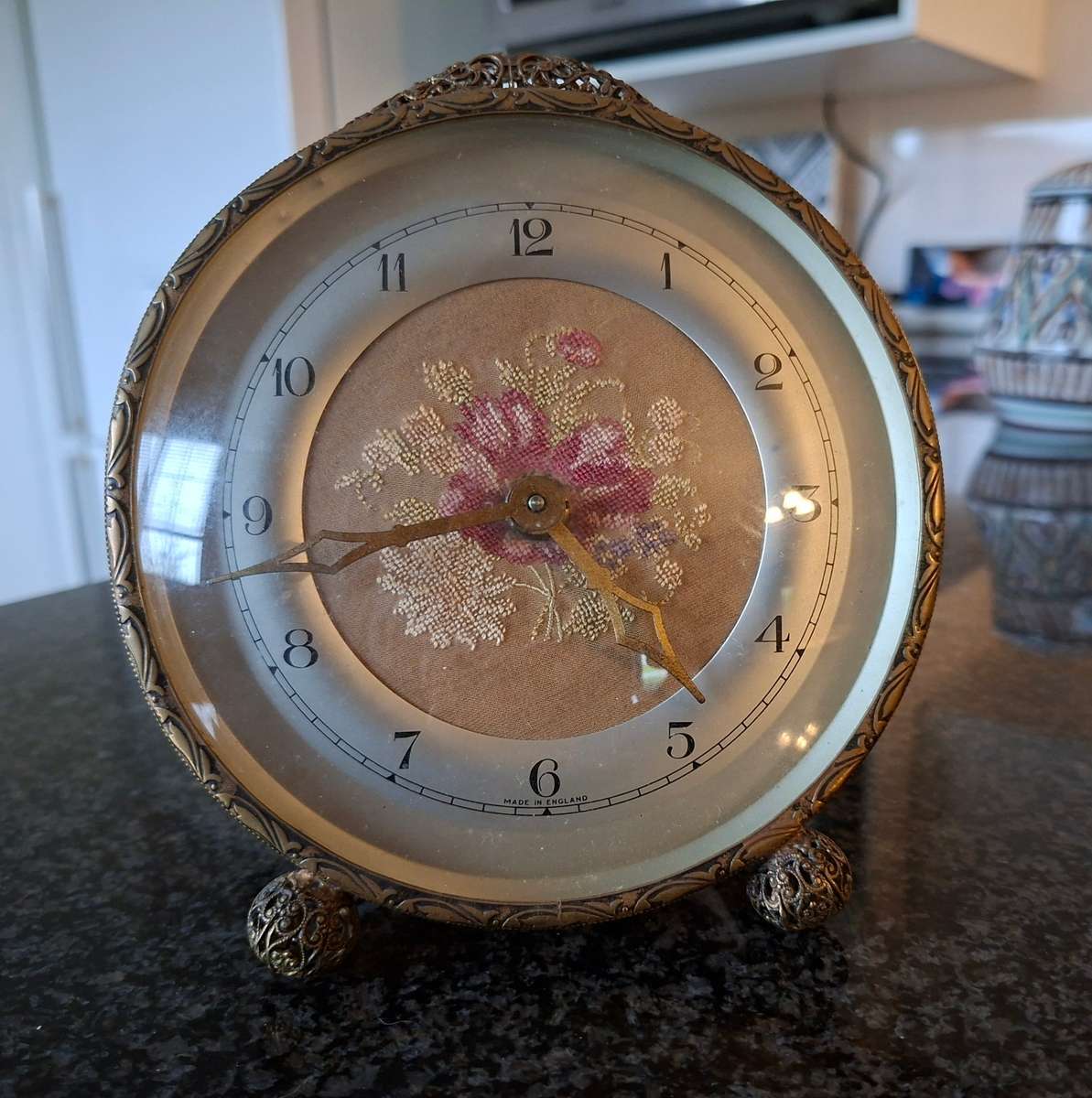 Mechanical Table Clock with petit point face - made in england.  Filigree metal feet.  Working