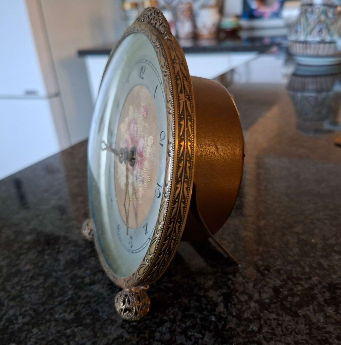 Mechanical Table Clock with petit point face - made in england.  Filigree metal feet.  Working