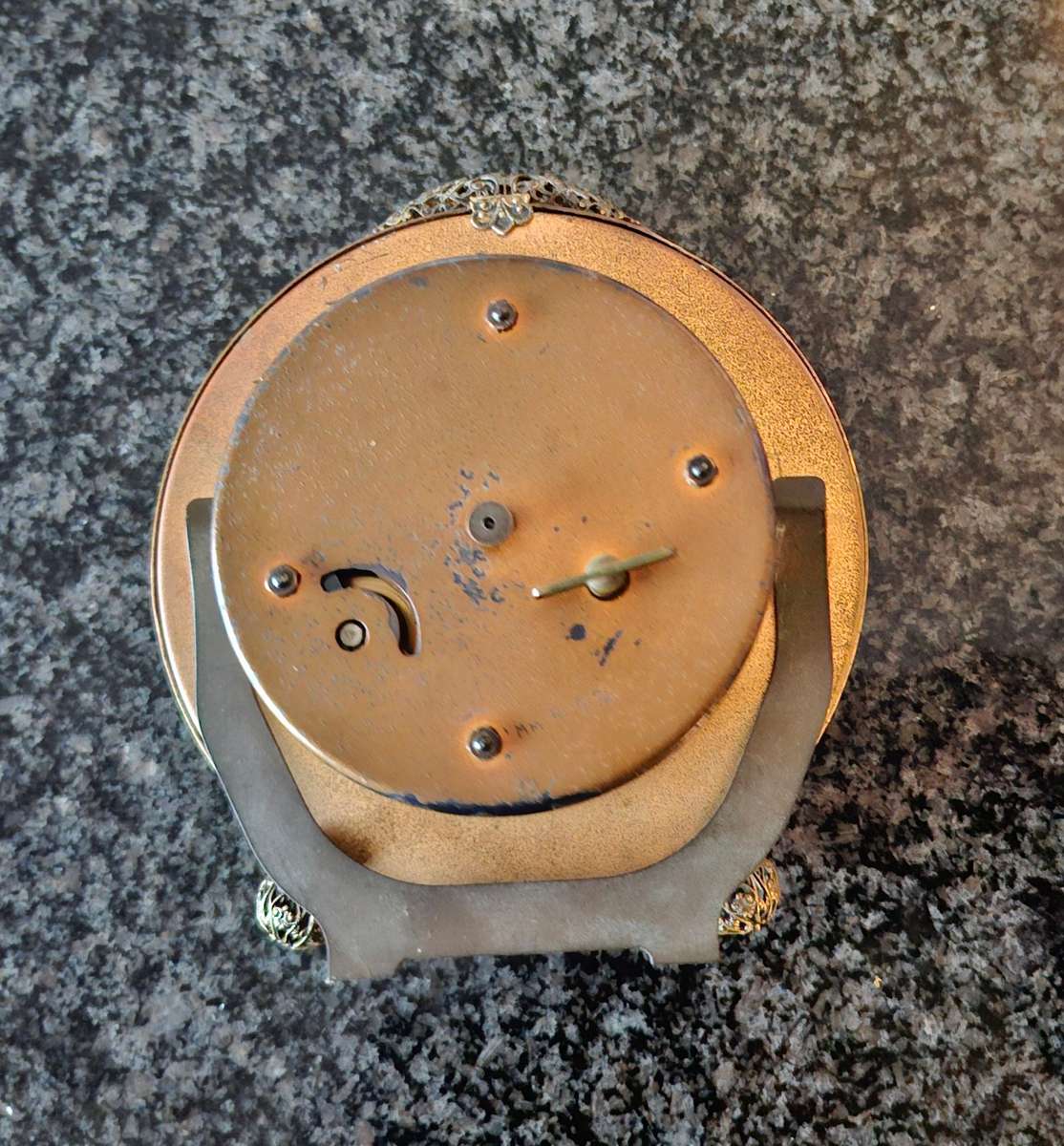 Mechanical Table Clock with petit point face - made in england.  Filigree metal feet.  Working